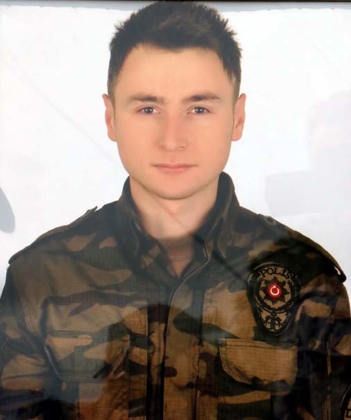 Özel harekat polisinin koluna yazdığı ayet 19