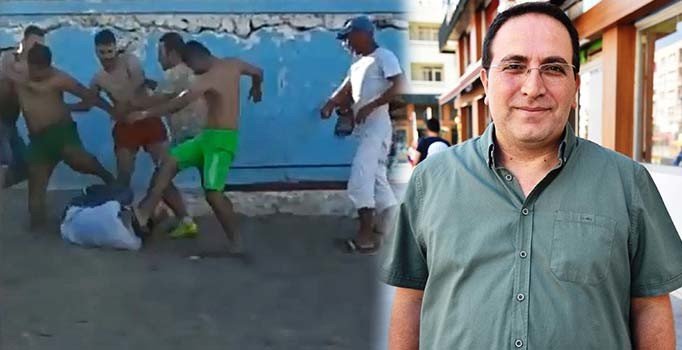 Sahilde eşini döven kişiyi çevredekiler darp etti