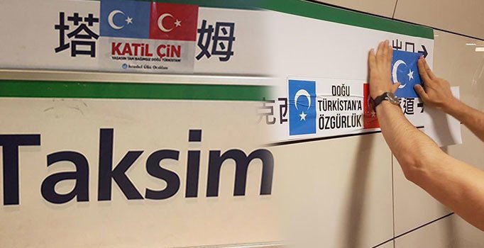 Duraklara asılan Çince tabelalara 'Doğu Türkistan' yapıştırmalı tepki
