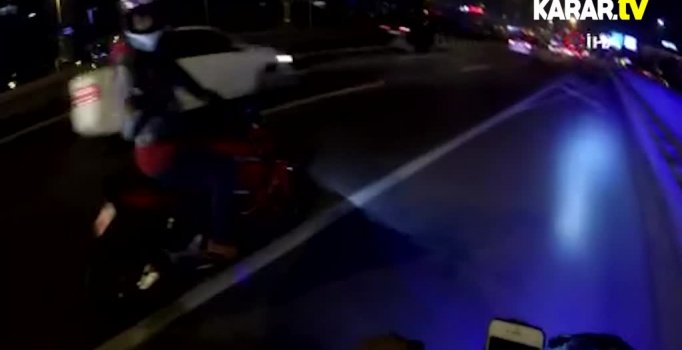 Motosiklet sürücüsü otobüsün altına torpil attı