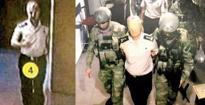 Darbe gecesi elleri bağlı görüntüsü çıkan Baki Kavun AA'nın geçtiği fotoğrafta serbest dolaşıyor