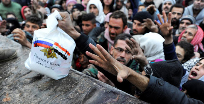 Halep'te Rusça yazılı yardım paketleri | Son dakika haberleri