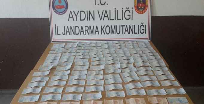 Evinde sahte paralarla yakalanıp, gözaltına alındı
