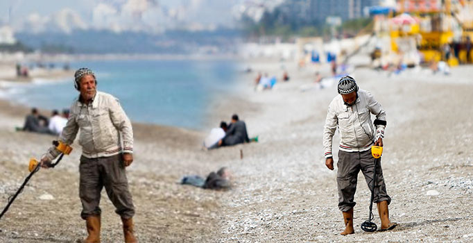 Ünlü sahilde madeni para avı