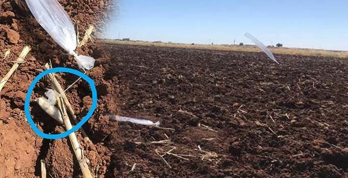 Ucunda mühimmat bağlı balonlar tarlaya düştü