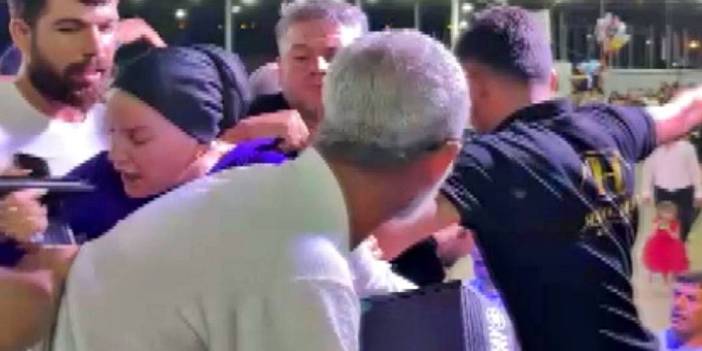 Karşısında şarkı söylemeyi reddeden şarkıcının boğazına yapıştı!