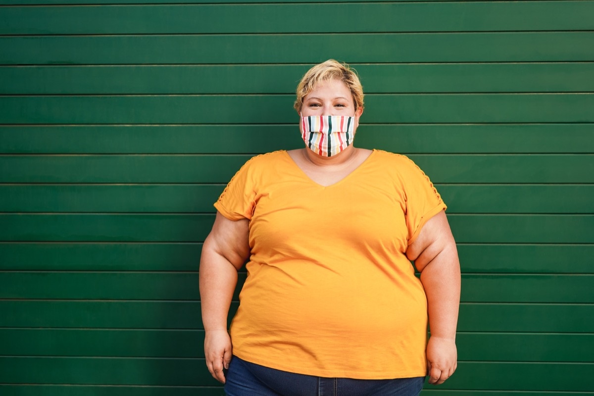 woman-obese-obesity-overweight-wall