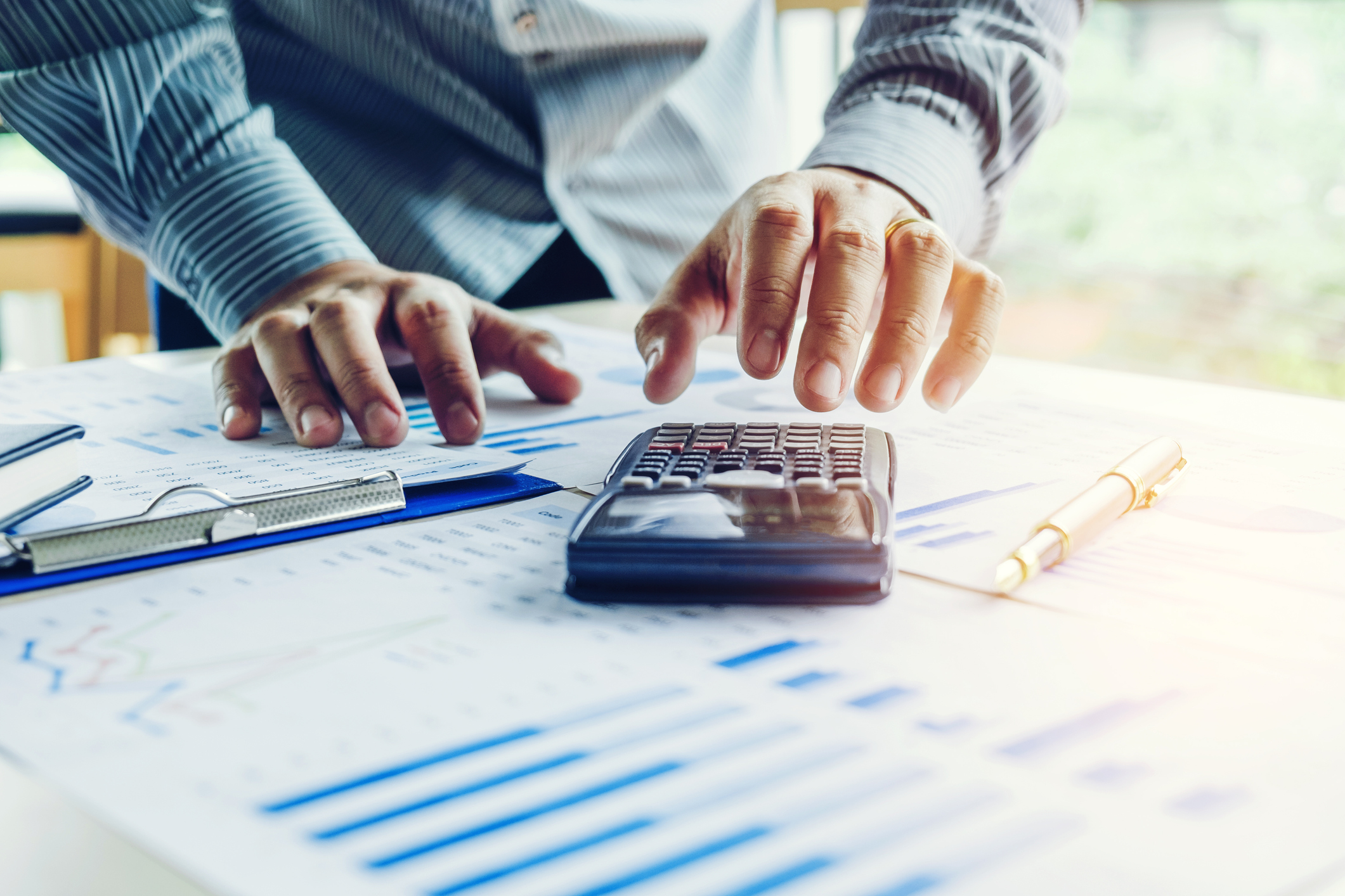 a-person-calculating-financial-data.jpg
