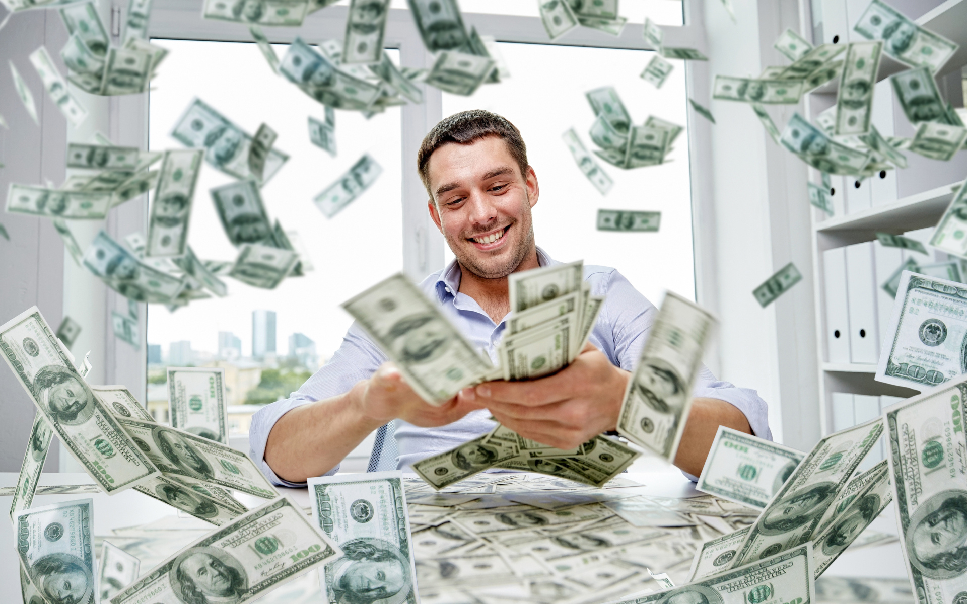 2017finance-wallpapers-money-a-smiling-man-is-scattering-dollars-117355-18.jpg