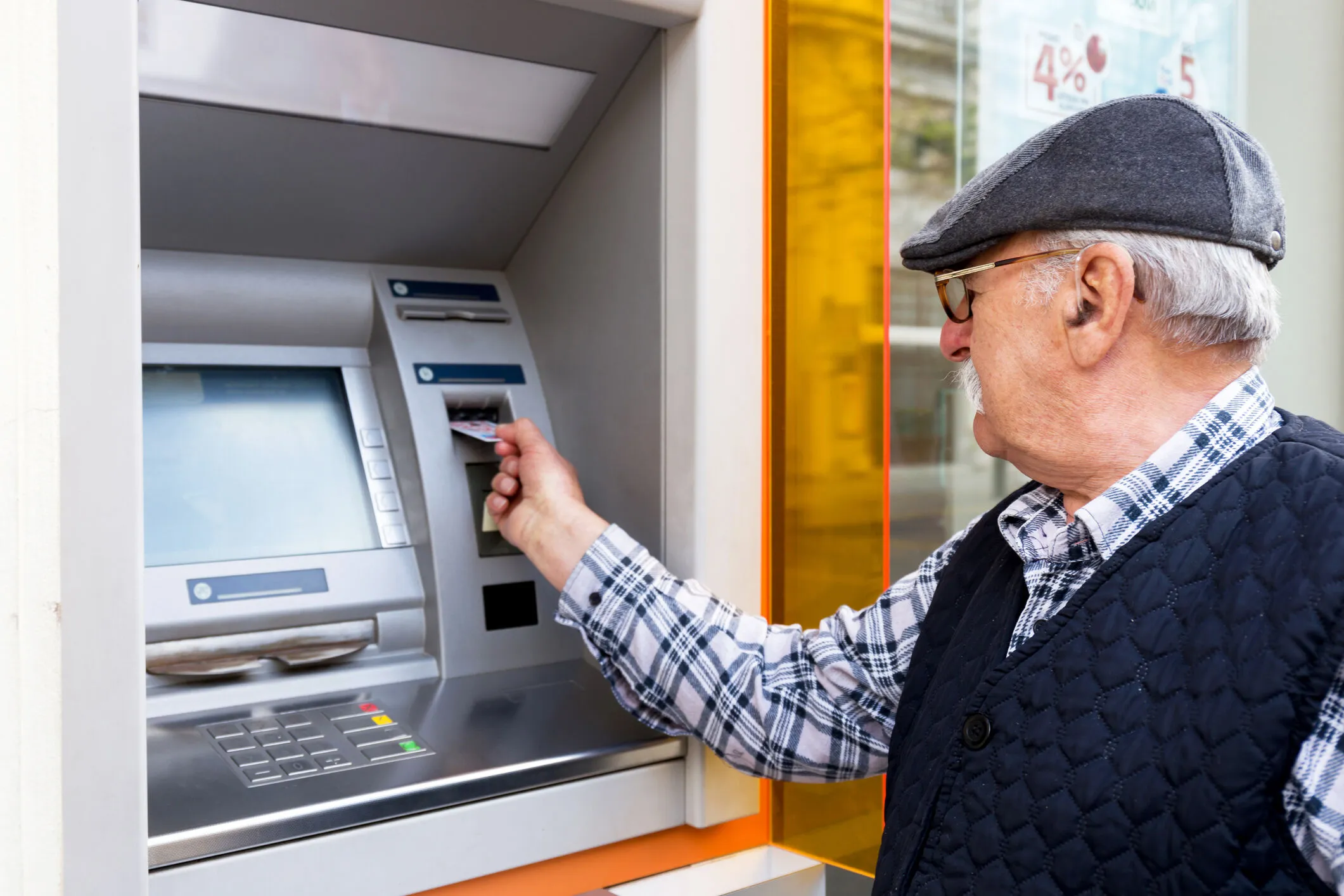 older-man-using-atm.webp