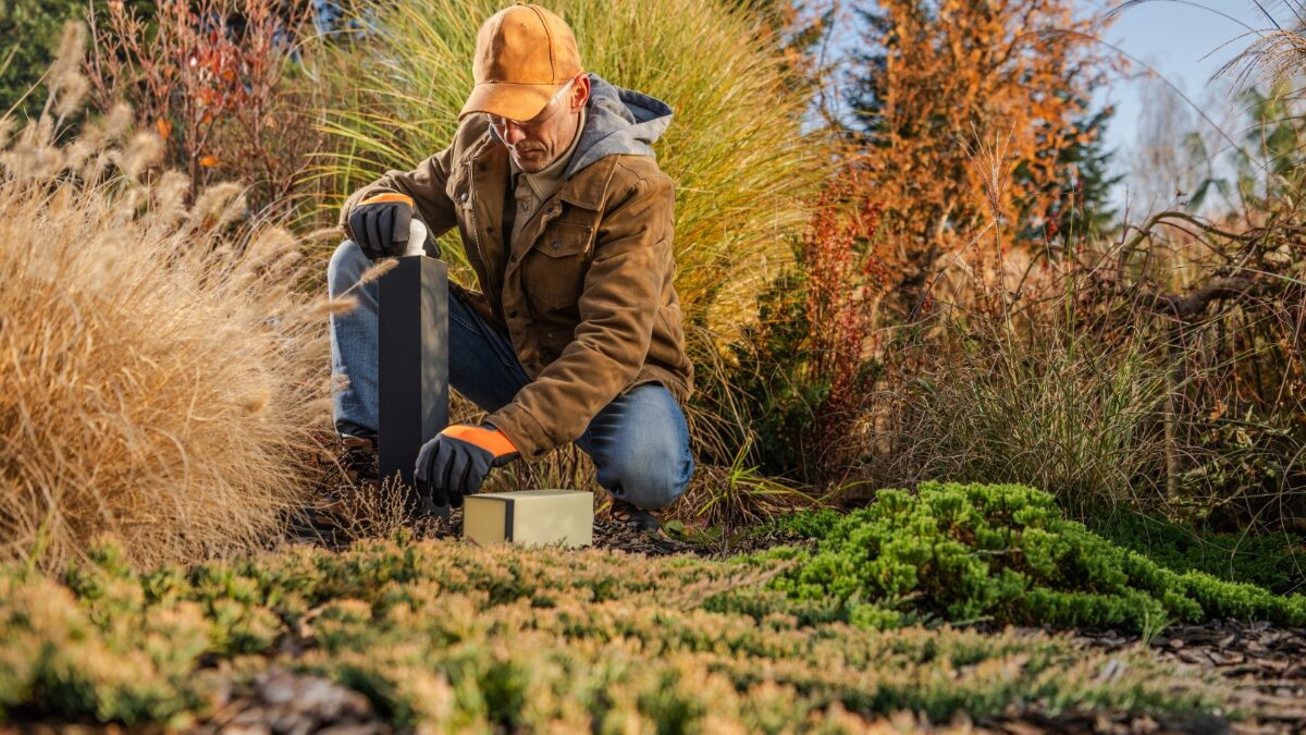 man-practicing-winter-lawn-care-on-wichita-lawn-1200x675
